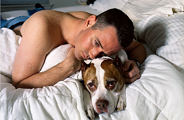 Photo of  Vet On Bed With His Dog